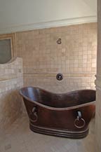 Shower with moveable mettal tub in master bath - Green Homes of Cabo San Lucas
